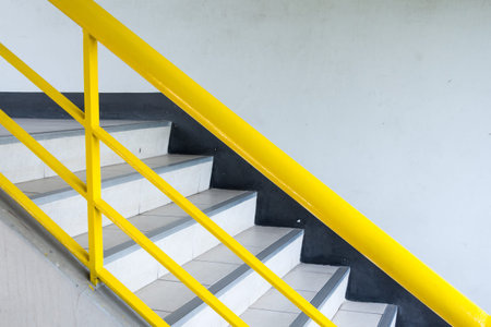 Yellow steel handrail in buildingの写真素材