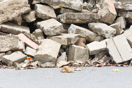 Stack of rubble on road with zone barrier tapeの写真素材