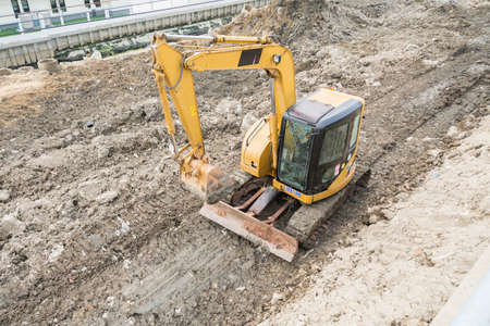Backhole dredging up in construction siteの写真素材