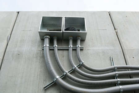 Conduits with junction box on wallの写真素材