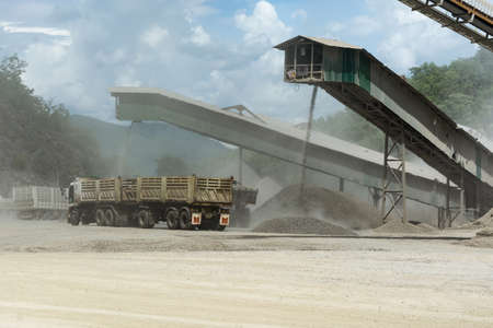 Lorry in quarry plant  with very dustyの写真素材