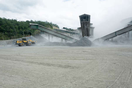 Lorry in quarry plant  with very dustyの写真素材