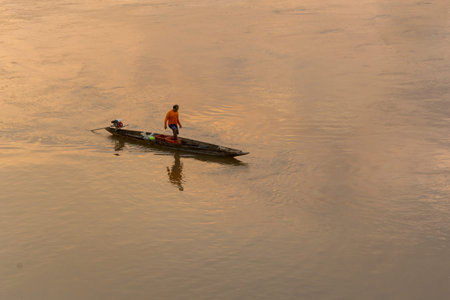 Fisherman has a boat on Mekong riverの写真素材