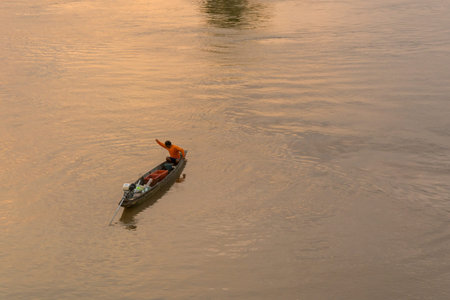 Fisherman boat on Mekong riverの写真素材