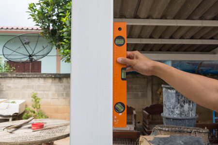 worker using leveling instrument  check appropriate columns