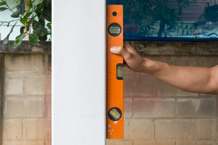 worker using leveling instrument  check appropriate columns