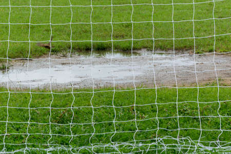 Soccer goal net against green backgroundの写真素材