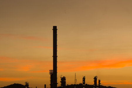 Gas flare silhouette at refinery