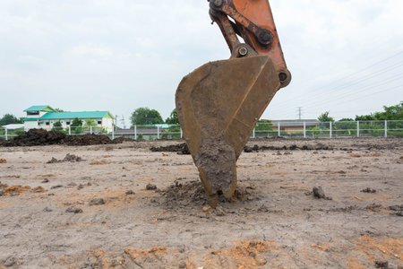 Loader excavator machine doing earthmoving work at construction site