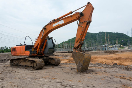 Loader excavator machine doing earthmoving work at construction siteの写真素材