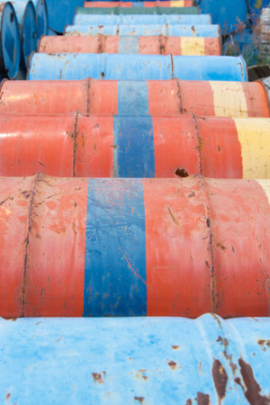 Stack of steel drums on floor