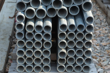 Stacks of steel pipe in factoryの写真素材