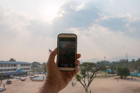 Telephone and sunriseの写真素材