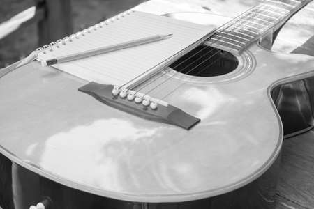 Acoustic guitar in gardenの写真素材