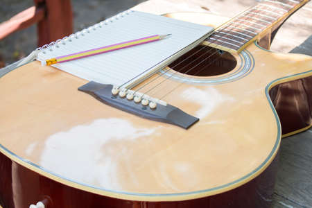 Acoustic guitar in gardenの写真素材