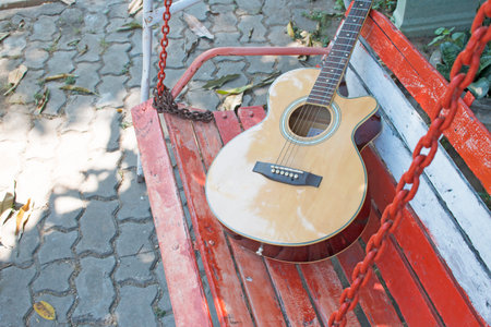 Acoustic guitar in gardenの写真素材