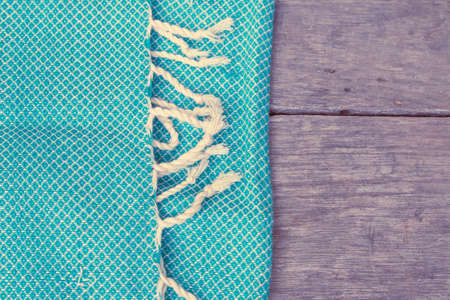 Classic fabric on wood backgroundの写真素材