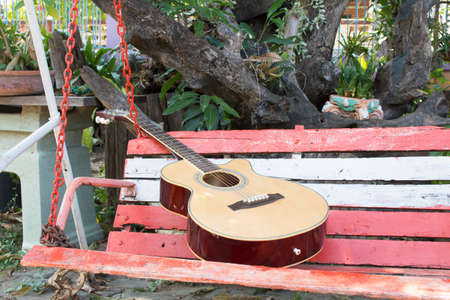 Acoustic guitar in gardenの写真素材