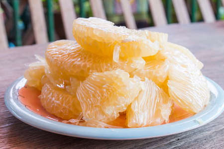 Pomelo on wood backgroundの写真素材