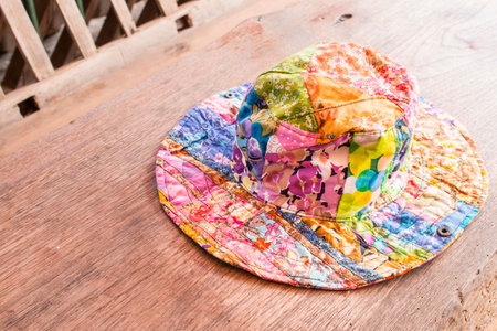 Colorful hat on wooden tableの写真素材