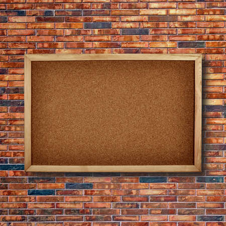 Wooden board on brick wall backgroundの写真素材
