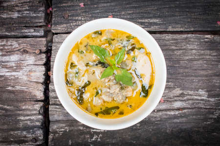 Green curry on wooden backgroundの写真素材