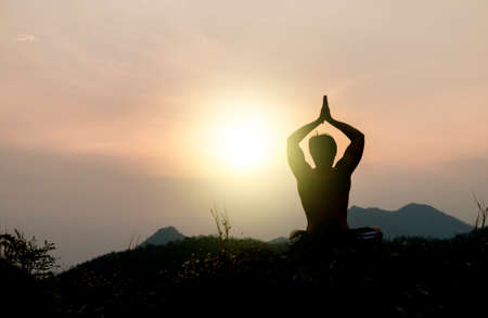 Yoga fitness,silhouette of manの写真素材