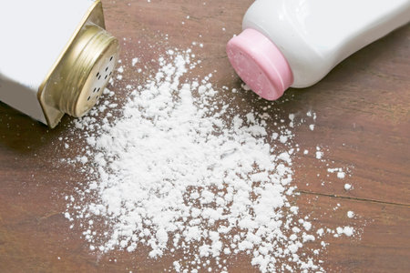 Talcums powder on wooden backgroundの写真素材