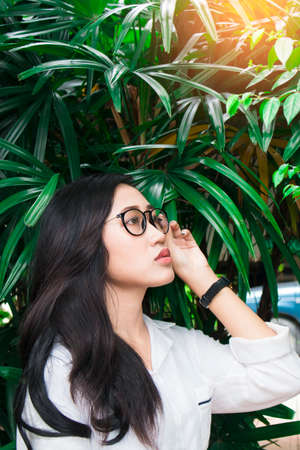 portrait teenager asian women in garden,life style conceptの写真素材