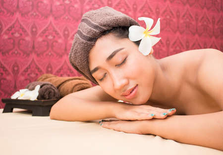 Beautiful woman with closed eyes relaxing in spa salonのeditorial素材