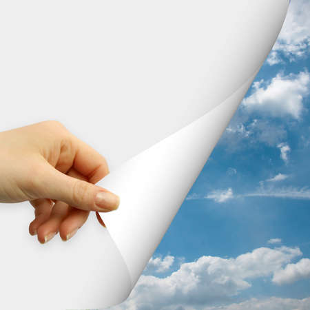 Human hand open view on blue skyの写真素材