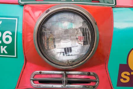 Color detail on the headlight of a vintage carの写真素材