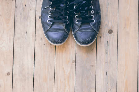 sneakers on wooden deckの写真素材