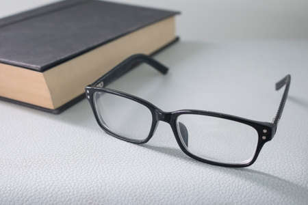 glasses with old bookの写真素材