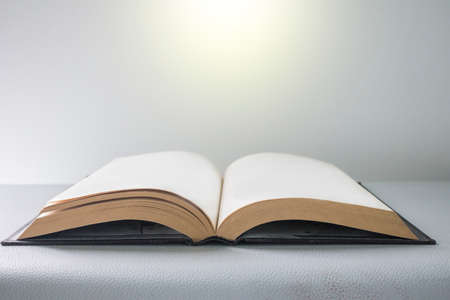 Open book with bright lightの写真素材