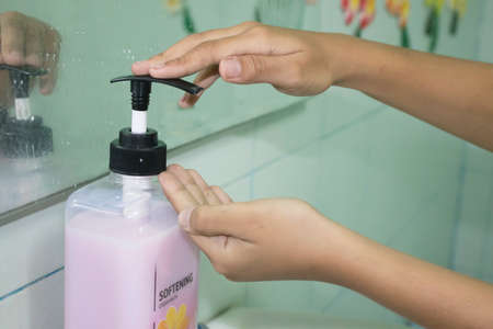Plastic bottle of skin care product  with handの写真素材
