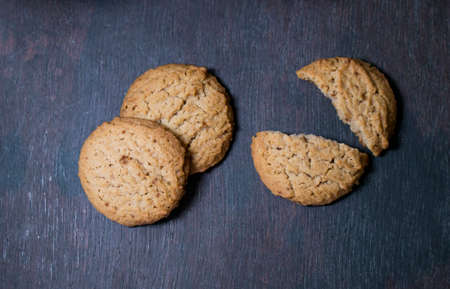 Top view of  cookies on a dark wooden backgroundの写真素材