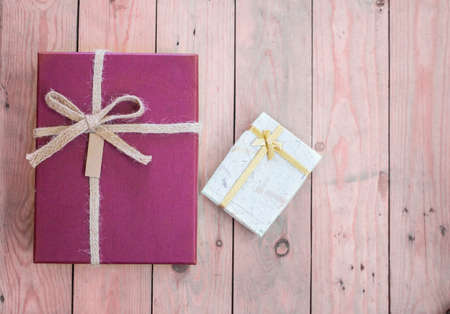 Two gift box on wooden table,holiday background,happy new year conceptの写真素材