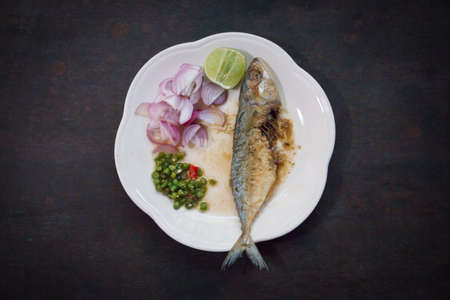 Salted fish Spicy salted with lemon,Pepper and Onionsの写真素材