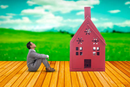 Business man sitting looking homeの写真素材