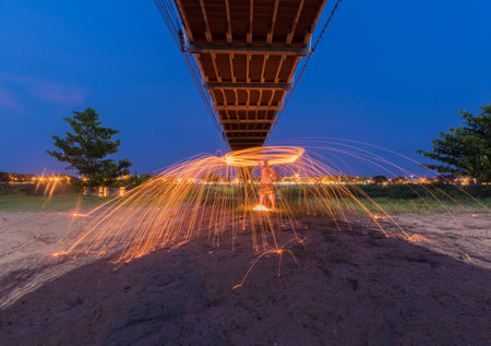Burning steel wool under the bridge