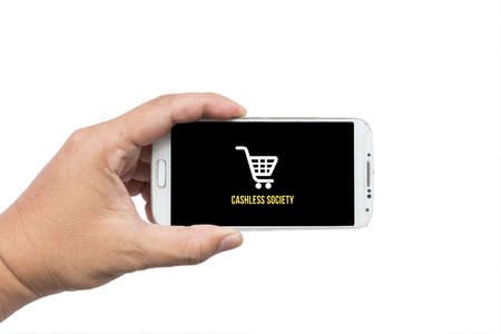 Businessman holding smartphone with Cashless society title on white background,Cashless society conceptの写真素材