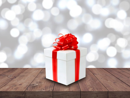 White  gift box on wooden table on chrismas background