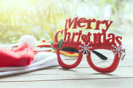Merry chrismas eyes glassess on woodtableの写真素材