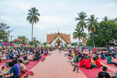 NAN, THAILAND - JUNE 2 Kat Kuang Muang is Activities square and walking street in front of Wat Phumin Nan on June , 2 2019 Kat Kuang Muang have Kan Tok which is wooden utensil for dinnerのeditorial素材