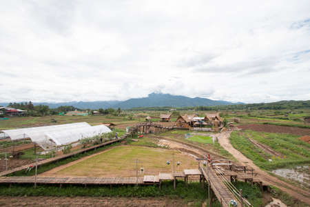 landscape surrounding there are fields and Beautiful mountains. Tubna thai lue famuous travel place. On June,2,2019 Pua District, Nan Province, Thailand.のeditorial素材