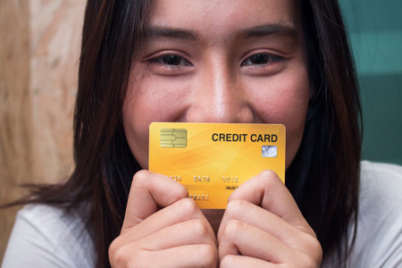 Close up asian women holding credit card