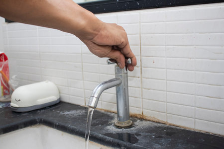 How covid-19 spreads in everyday life.Hand open for drinking tap water