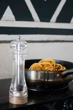 Pepper mill in kitchenの写真素材