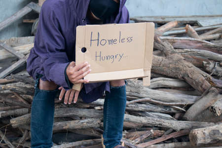 Close-up of homeless and hungry street person asking for helpの写真素材
